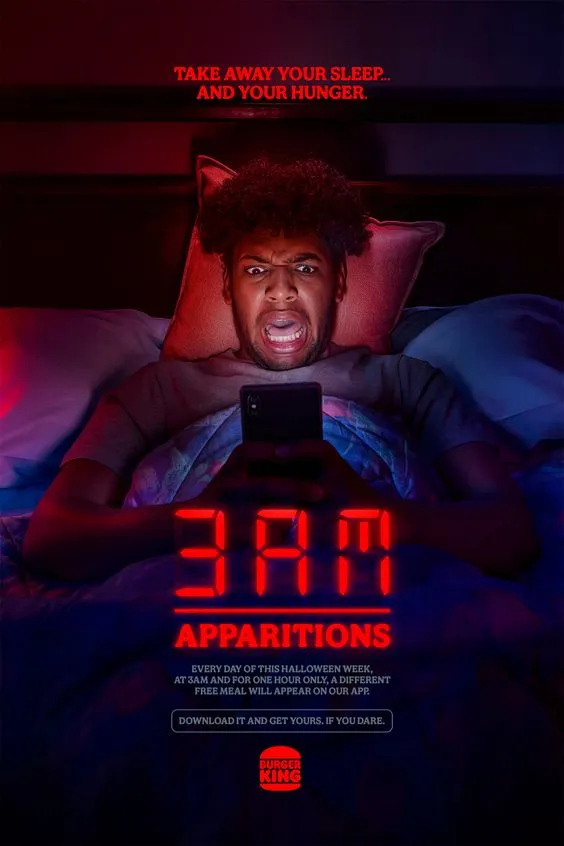 Burger King 3AM Apparitions poster: a man startled in bed by his phone, under the caption take away your sleep and your hunger