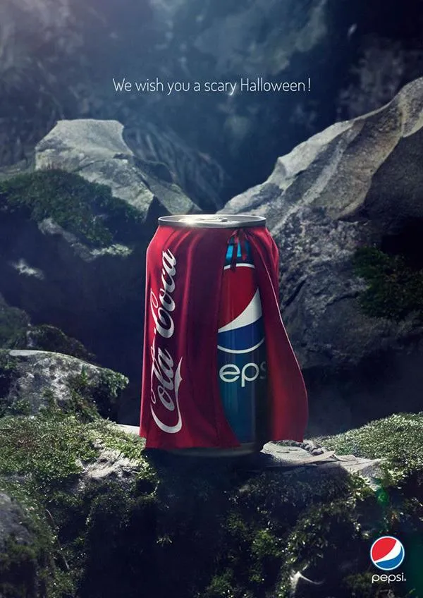 Pepsi Halloween ad showing a Pepsi can wearing a Coca-Cola cape with the line We wish you a scary Halloween