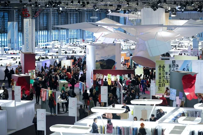 Trade fair hall at Paris Nord Villepinte seen from above, stands and visitors under the roof lights